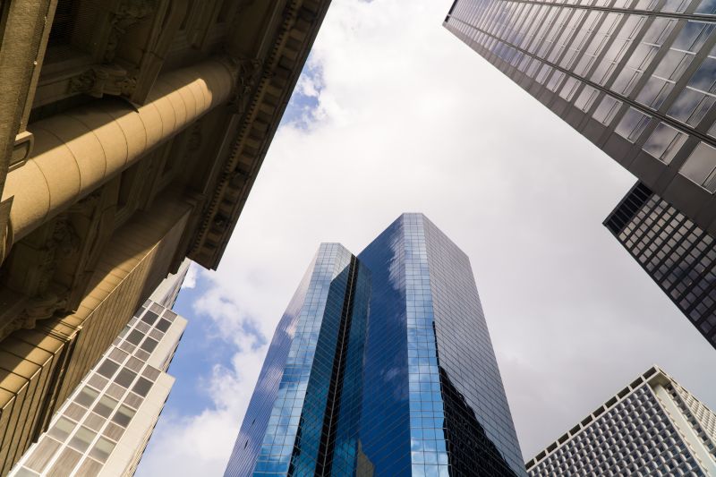 blue glass walled high rise building.jpg